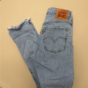 Levi's Faded Blue Denim with Frayed Edges